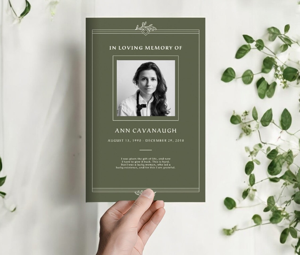 Elegant Remembrance funeral program template with a green background, photo placeholder, and customizable text for a timeless tribute.